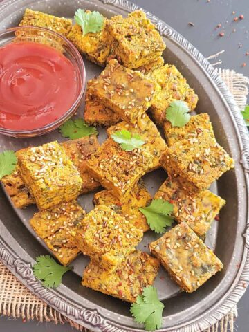 Close up image of kothimbir vadi which is Indian savory cilantro fritters made in Instant Pot and Air Fryer.