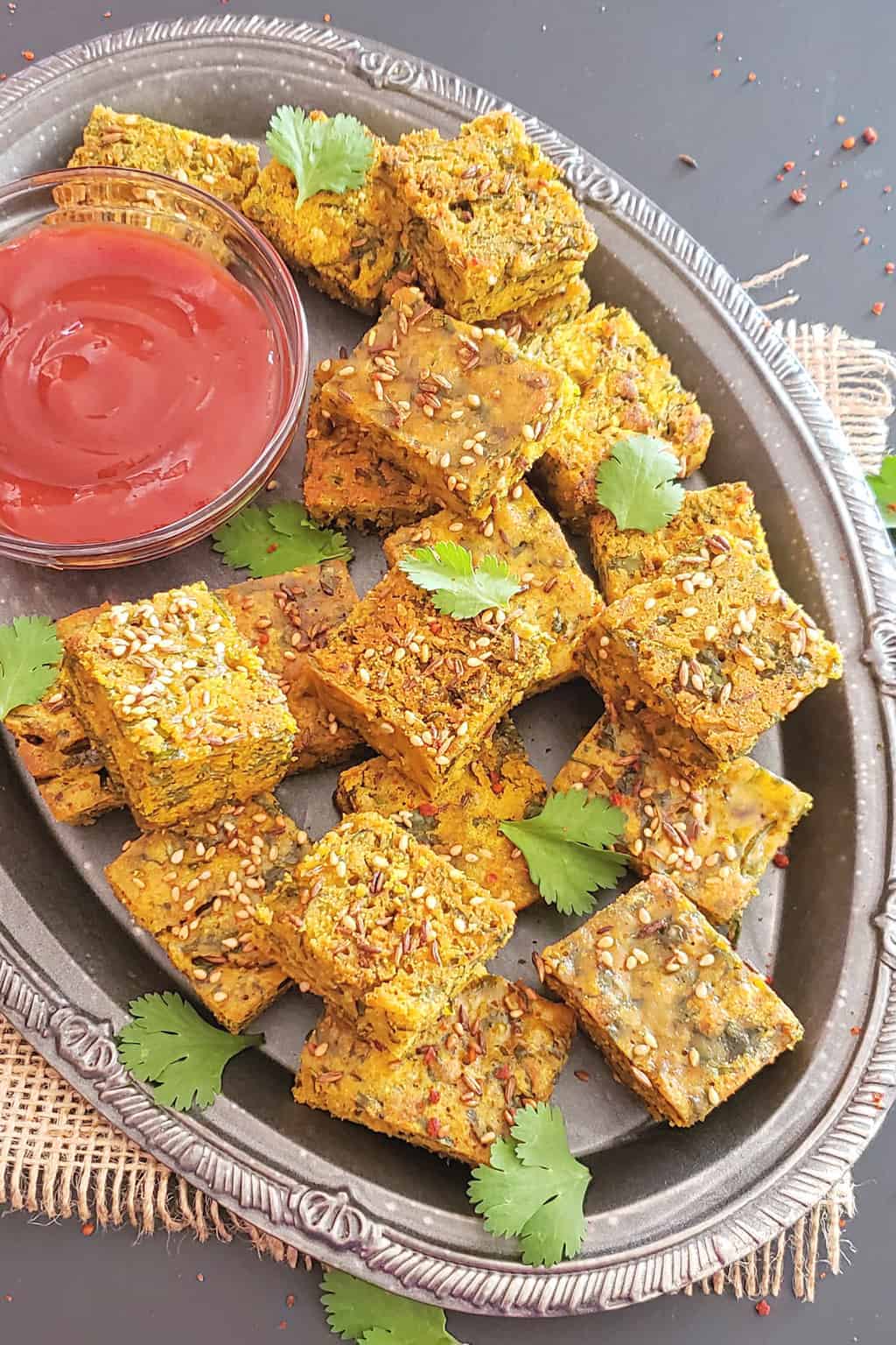 Close up image of kothimbir vadi which is Indian savory cilantro fritters made in Instant Pot and Air Fryer.