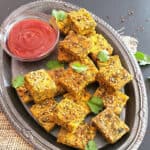 Pinterest image with text overlay for kothimbir vadi which is Indian cilantro fritters recipe.