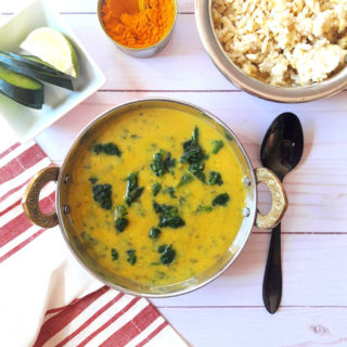 Dal Palak with Rice and turmeric in serving bowl