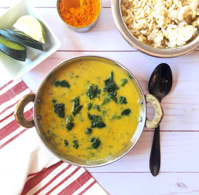 Dal Palak with Rice and turmeric in serving bowl