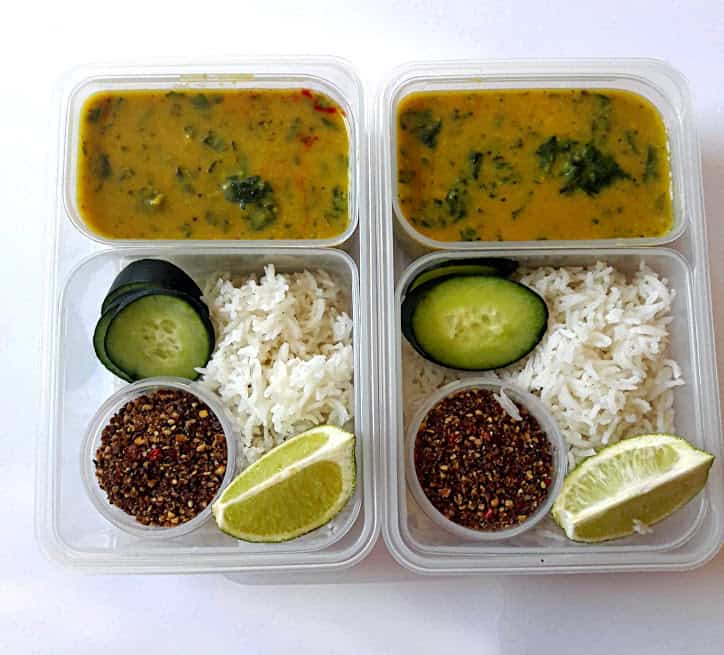 Spinach Lentil Curry with Rice in a lunch box container