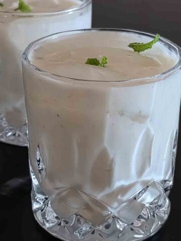 Authentic Indian Spiced Buttermilk drink called Chaas or Mattha recipe made with yogurt, cumin, mint, and herbs.