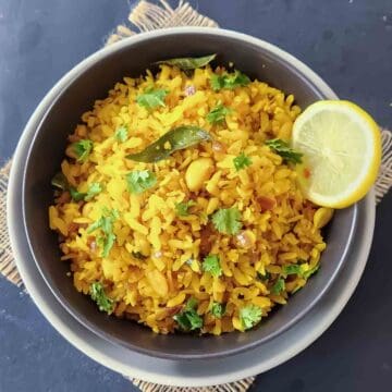 Easy Indian Poha Recipe made with flattened rice, onions, curry leaves, and turmeric.