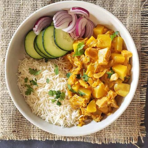 Green Jackfruit and potato coconut curry served with rice and pickle.
