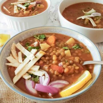 A bowl full of vegan lentil chili made as a one pot comfort food in Instant Pot for gluten-free and plant based dinner.