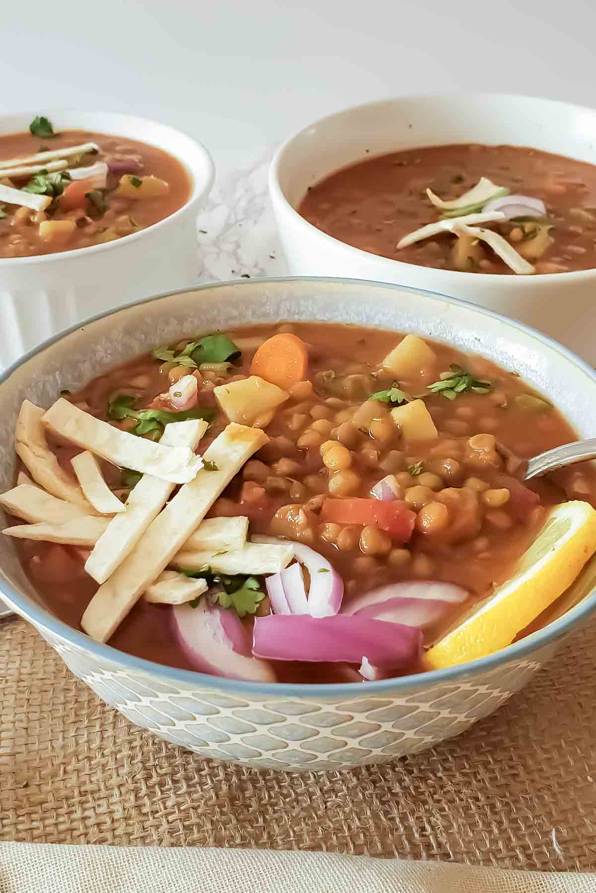 Showing chunky and hearty texture of meatless lentil chili.