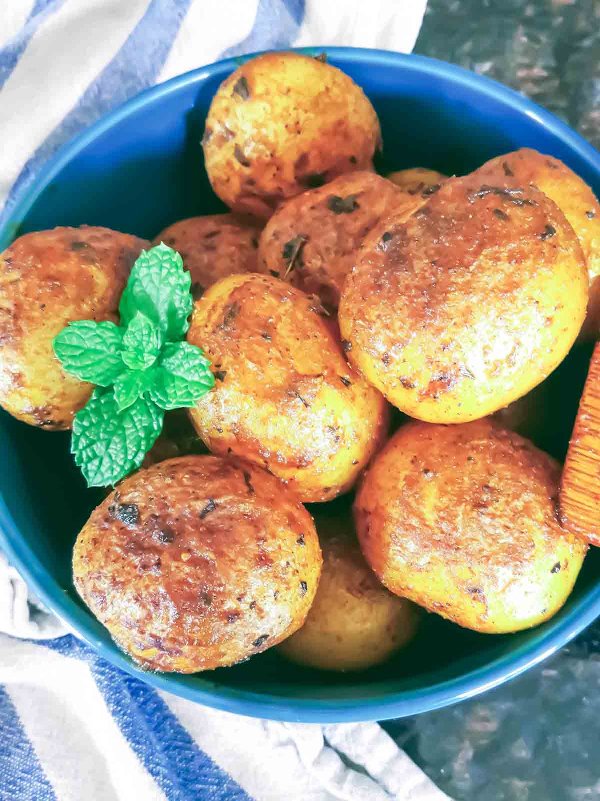 Bombay potatoes which are spicy Indian street food from Mumbai Cuisine served in a bowl.