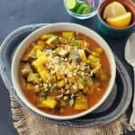 Indian Eggplant Curry combines tender eggplant and potatoes with tomatoes and aromatic Indian spices. A flavorful vegan and gluten-free Aloo Baingan recipe with Instant Pot and stovetop instructions.