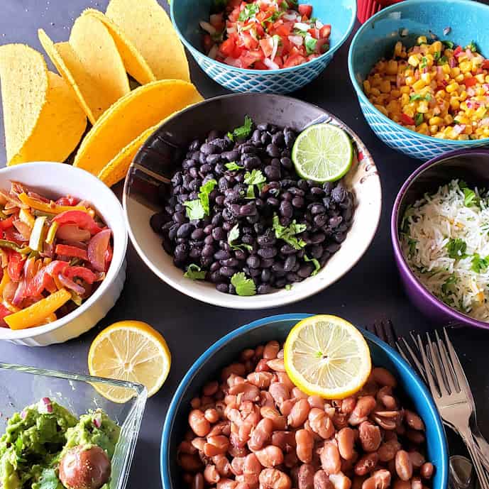 Seasoned Pinto Beans and Black Beans are part of taco fieasta.