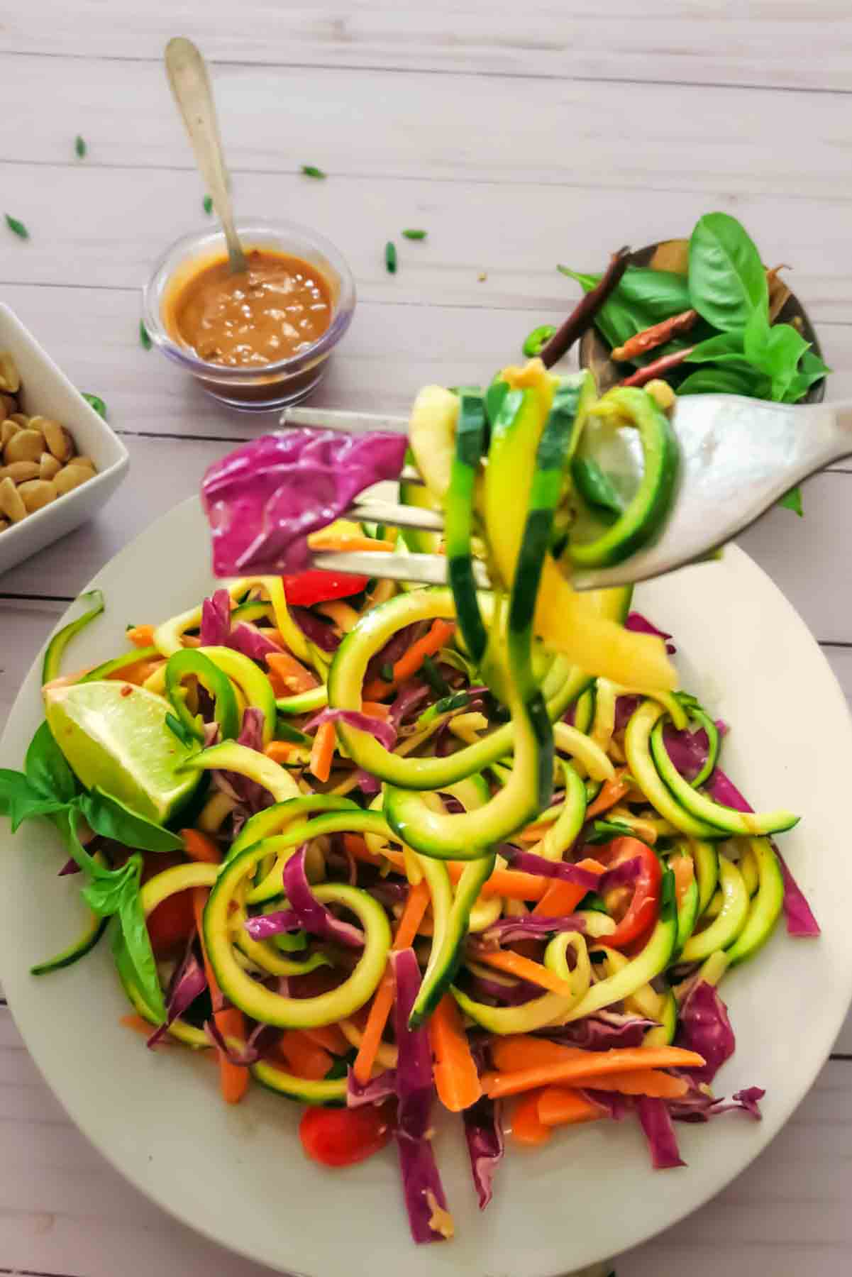 Thai zucchini noodles with peanut sauce in a bowl.