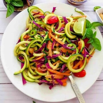 Healthy low carb Thai zucchini noodle recipe with spicy peanut sauce.