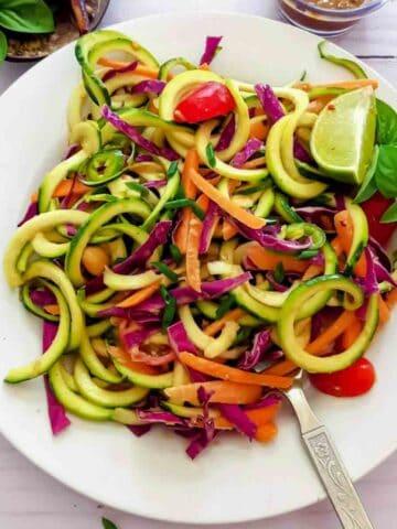Healthy low carb Thai zucchini noodle recipe with spicy peanut sauce.