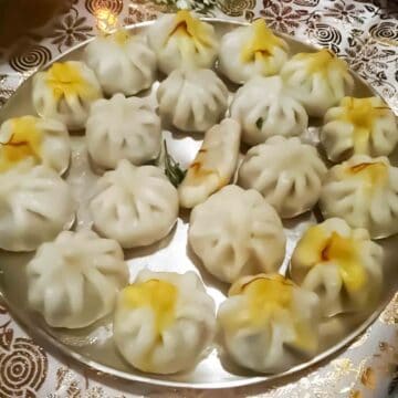 Handmade Ukadiche Modak served on Silver platter for Ganesh Prasad.