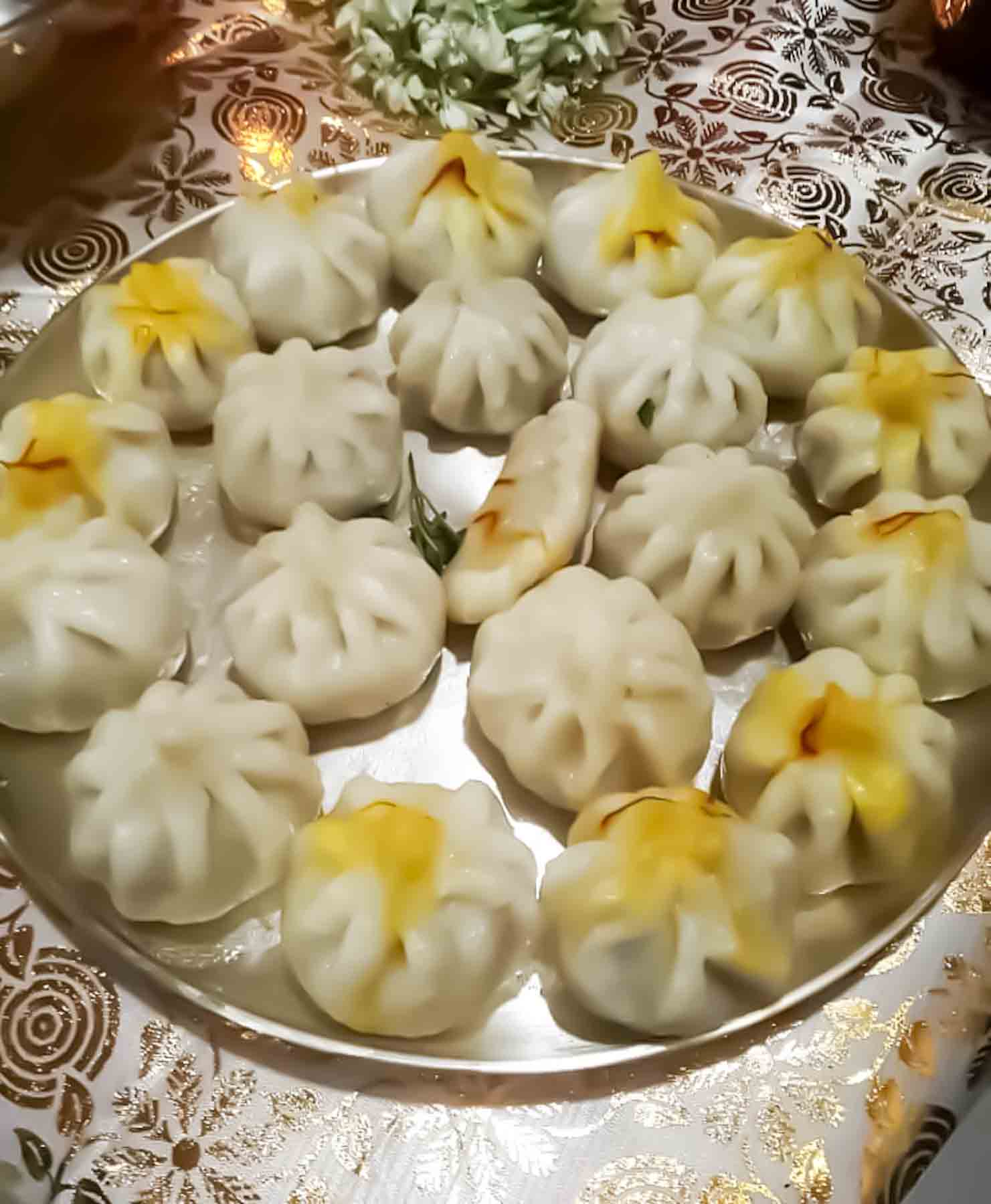 Handmade Ukadiche Modak served on Silver platter for Ganesh Prasad.