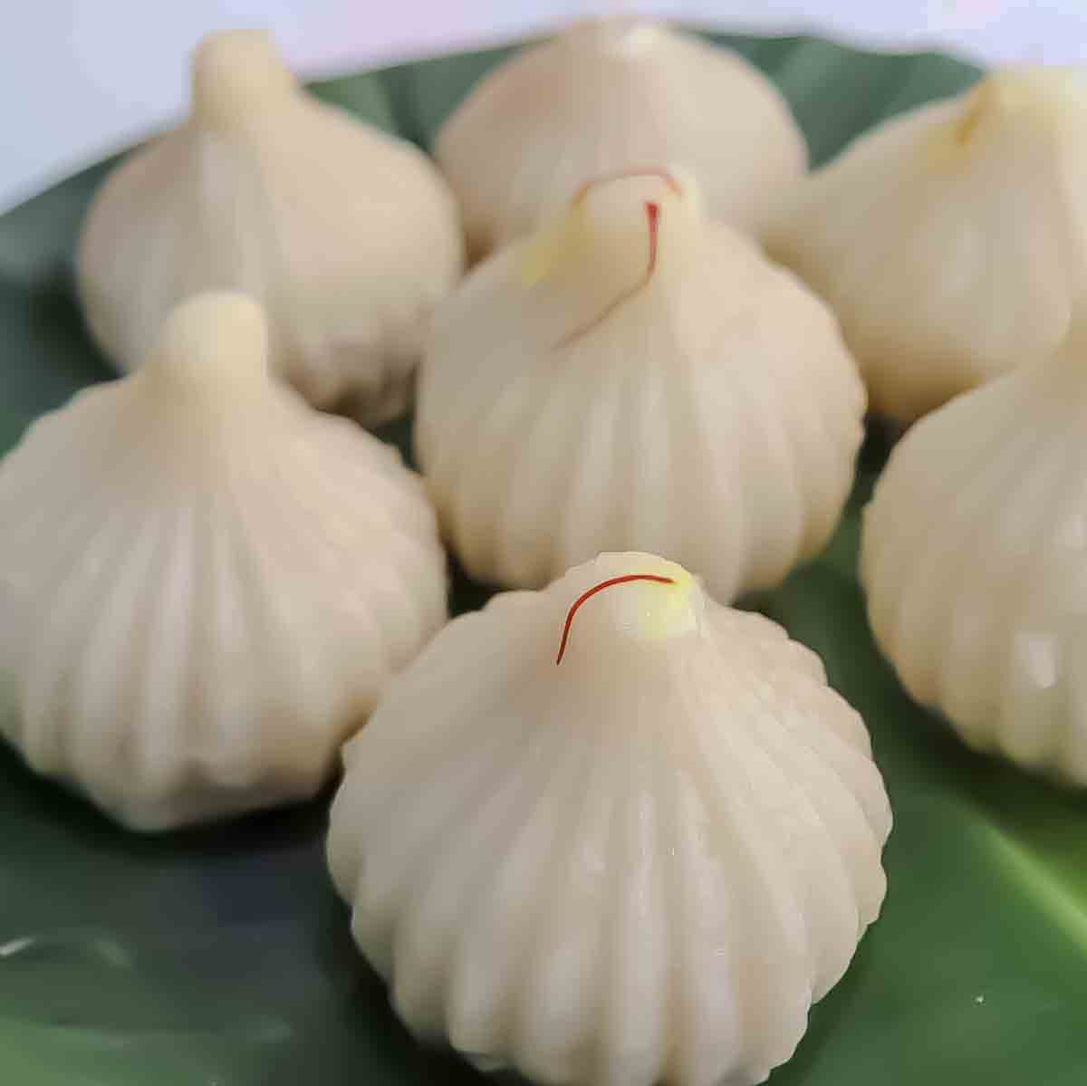 Traditional Maharashtrian steamed modak for Ganesh Chaturthi. This ukadiche modak recipe is heirloom recipe from Maharashtra India.