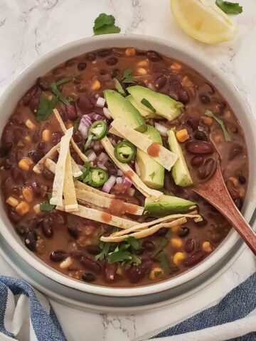 A bowl full of hearty comforting Vegetarian chili recipe with beans. This earthy comfort food makes excellent one pot meal.