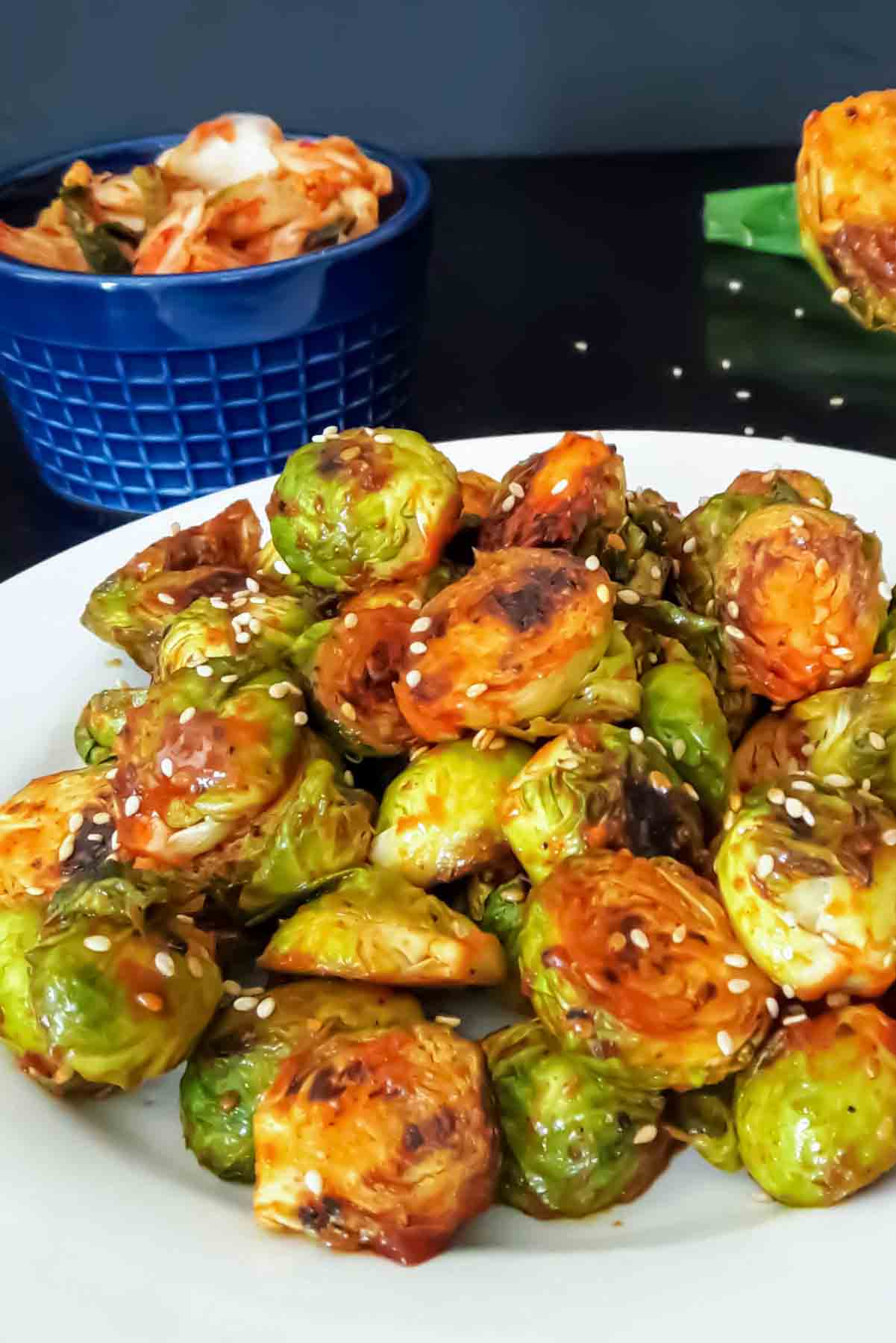 Spicy roasted Brussels sprouts coated with gochujang sauce for Asian inspired side dish.