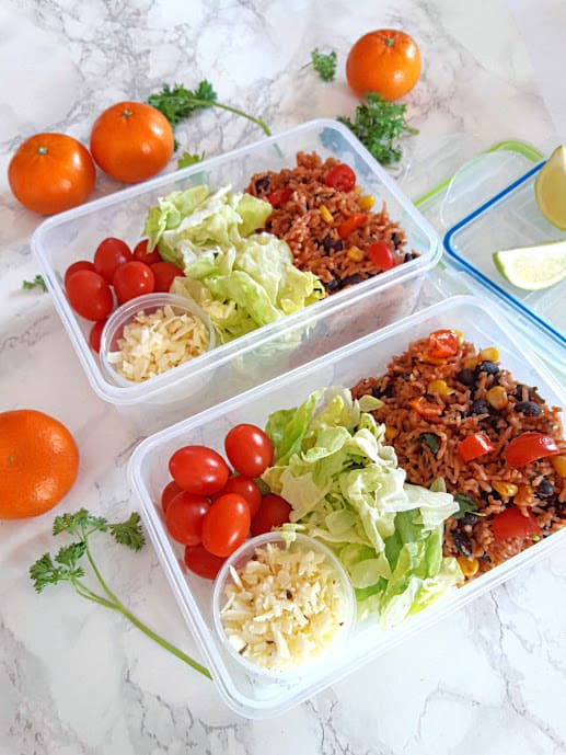 instantpot vegan Enchilada rice divided into two meal prep containers for lunch