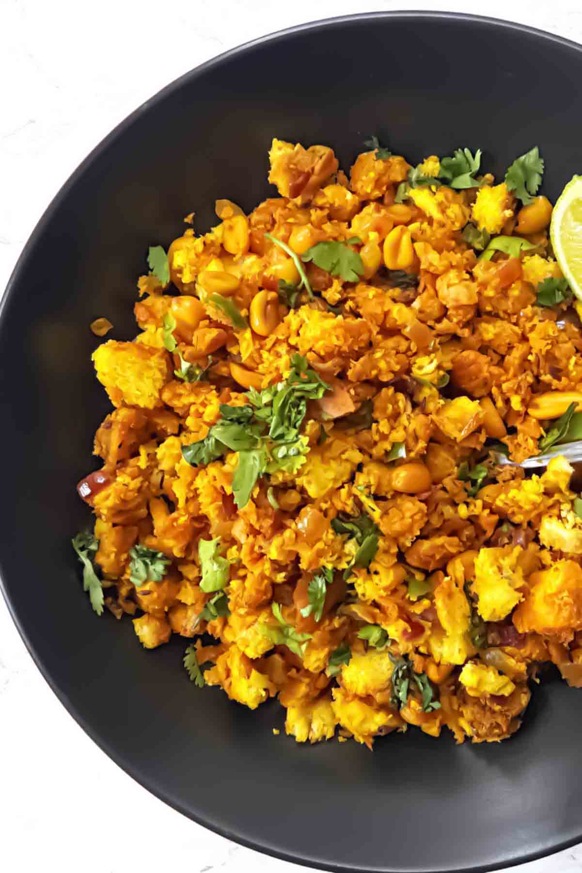 Bread Upma Recipe served in a bowl with vegetables and fresh cilantro.