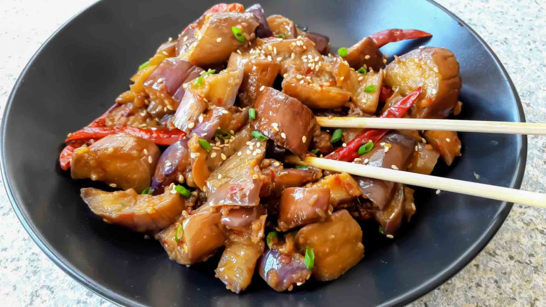 Easy garlic eggplant stir fry in a pan with rich thick sauce.