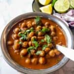 Close-up of Punjabi chickpea curry made in Instant Pot with rich tomato gravy. This vegan chana masala is also gluten-free.