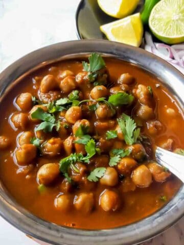 Close-up of Punjabi chickpea curry made in Instant Pot with rich tomato gravy. This vegan chana masala is also gluten-free.