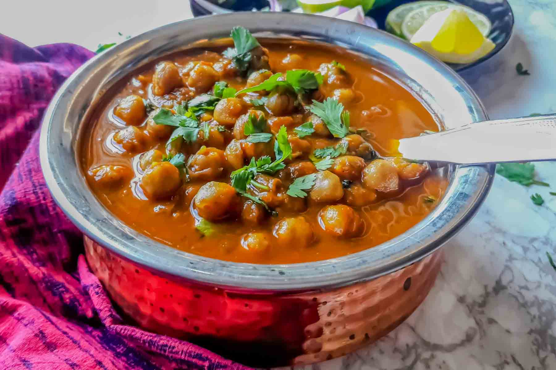 Chana Masala-Punjabi Chole-Indian Chickpea Curry in copper serving bowl.
