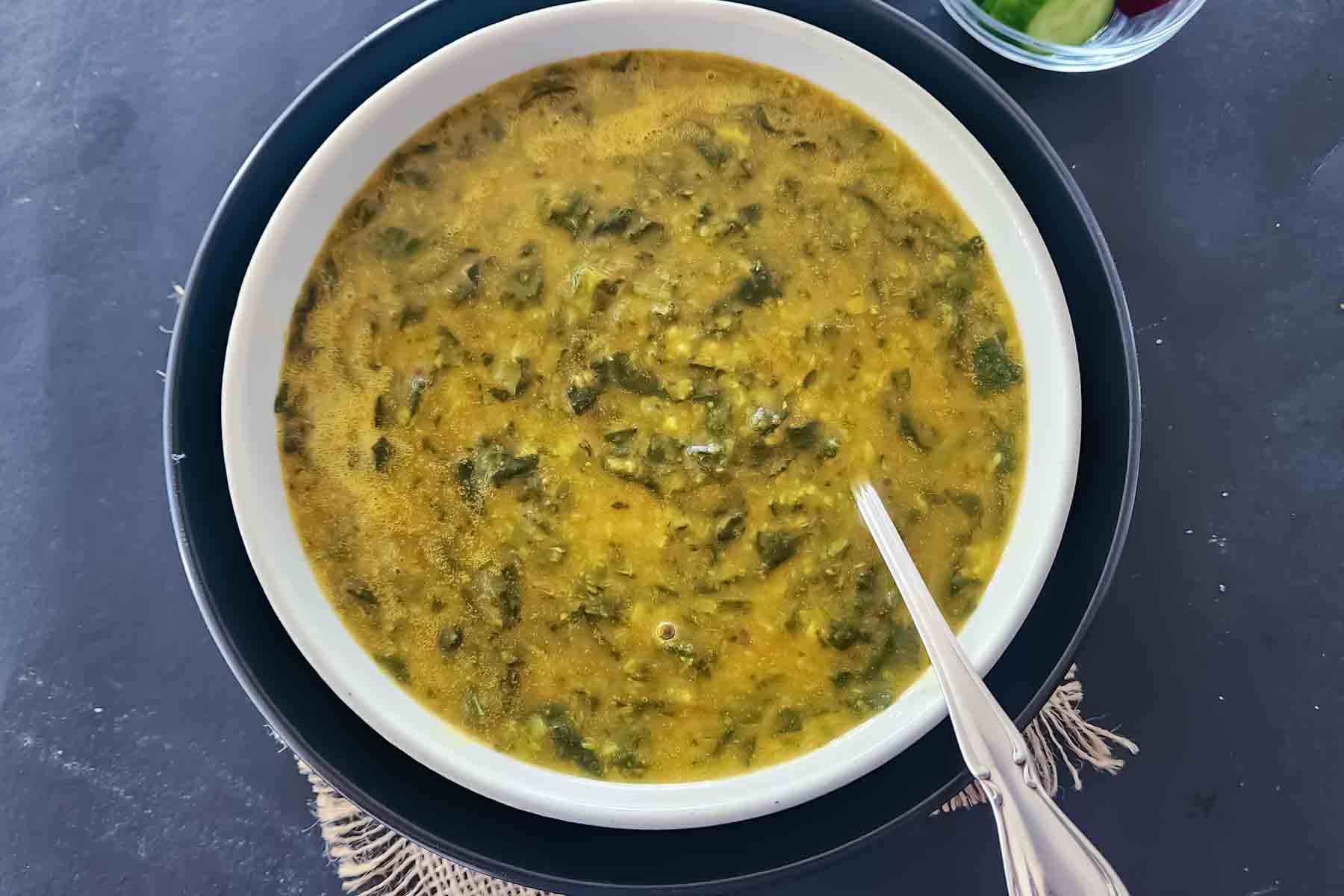 Creamy vegan Dal Palak with spinach, lentils, garlic, and aromatic spices.