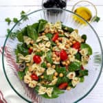 Greek Fresh Pasta Salad with parsely, olives and summer veggies. Overhead photo of profusioncurry recipe