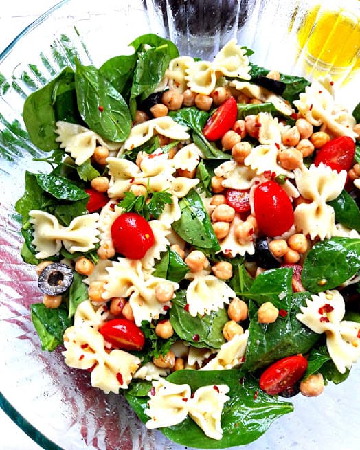 Pasta Salad with fresh veggies and chickpeas marinated in lemony greek vinaigrette