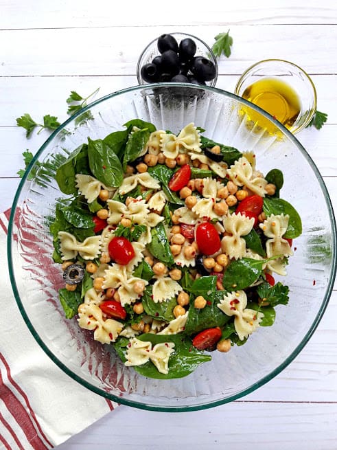 Greek Fresh Pasta Salad with parsely, olives and summer veggies. Overhead photo of profusioncurry recipe