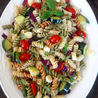 Italian Pasta Salad served cold to brighten your summer gatherings. Cooked pasta, rainbow veggies , marinated cheese make this delicious and easy side dish created by ProfusionCurry