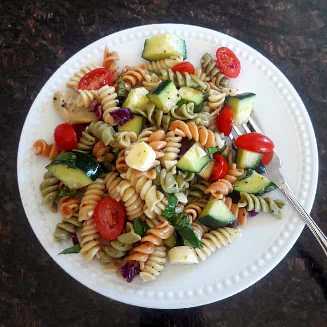 Classic Italian Pasta Salad with tri color rotini, cherry tomatoes, cucumbers, cheese and marinade. Perfect summer recipe by ProfusionCurry