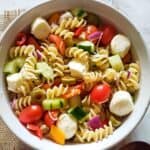 Vibrant and hearty Italian Pasta salad with full of veggies and cheese and flavorful dressing.