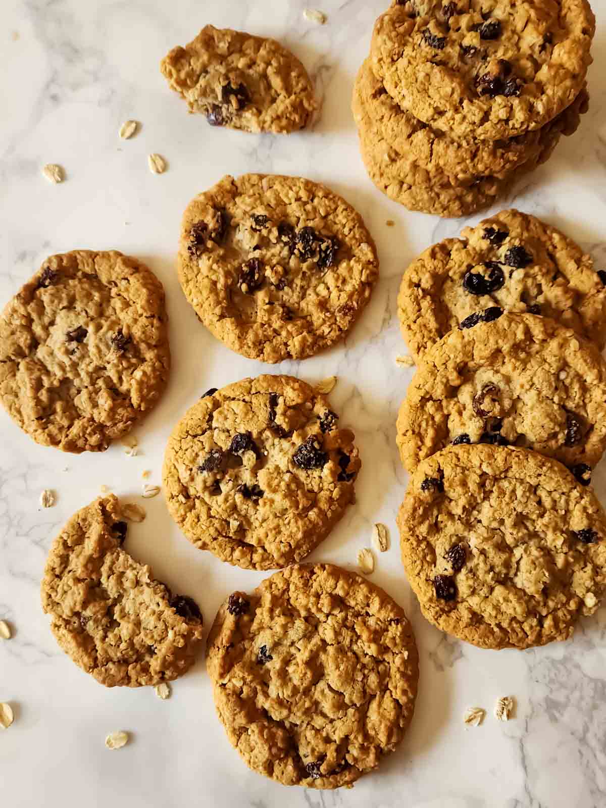 A tray full of vegan  oatmeal cookies with raisins and banana.