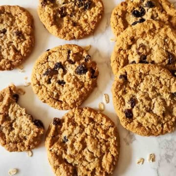 Freshly baked banana oatmeal raisin cookies made with wholesome ingredients. These vegan and gluten-free oatmeal raisin cookies are perfect with coffee, in lunchboxes, or as a healthier treat.