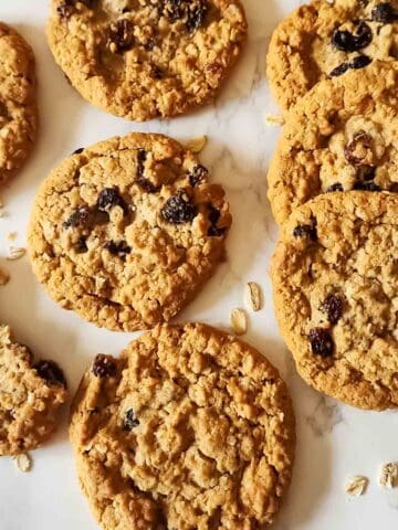 Freshly baked banana oatmeal raisin cookies made with wholesome ingredients. These vegan and gluten-free oatmeal raisin cookies are perfect with coffee, in lunchboxes, or as a healthier treat.