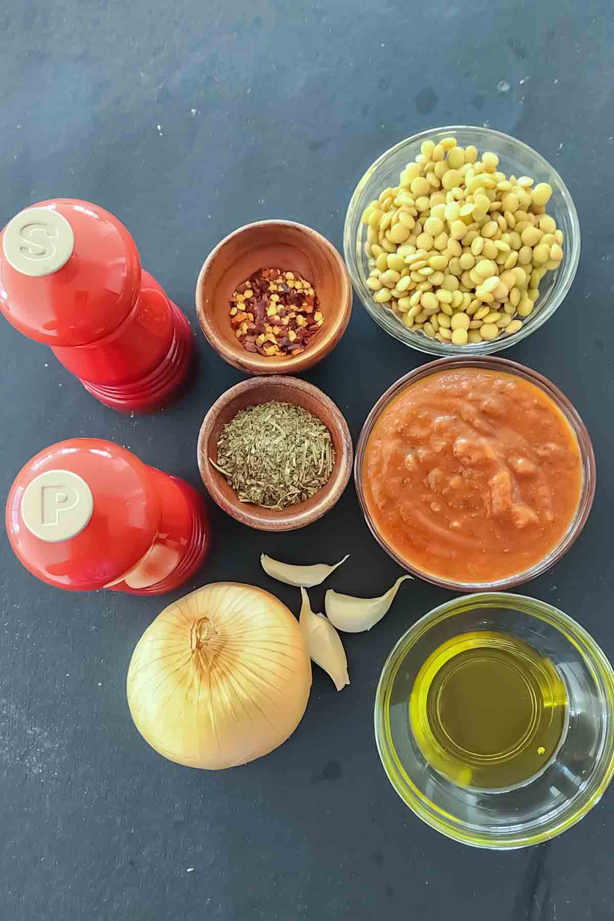 Ingredients used in making vegan and gluten-free Bolognese sauce with lentils for spaghetti. 