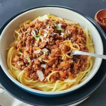 Instant Pot lentil Bolognese served over spaghetti.