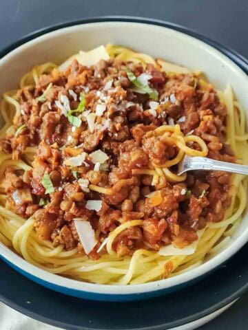 Instant Pot lentil Bolognese served over spaghetti.