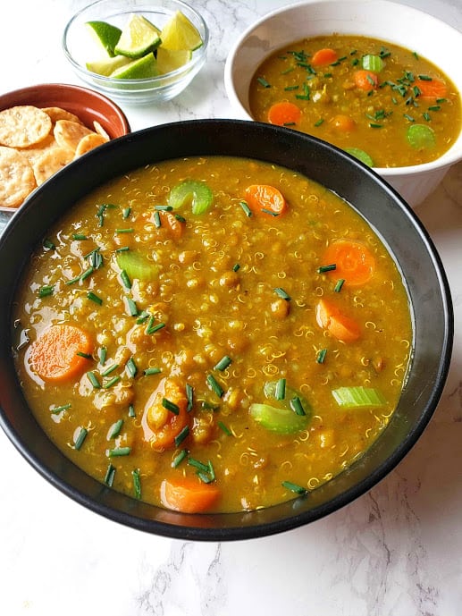 Close up shot of Lentil Quinoa Vegetables Soup showing vibrant colors and soft hearty texture.