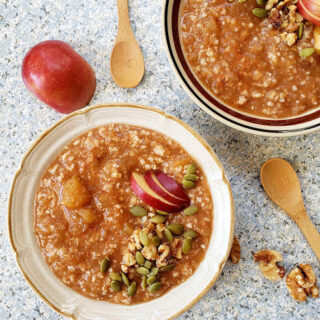 Caramel creamy Apple Pie Oatmeal made in Instantpot is served for breakfast. This easy and healthy recipe includes simple pantry ingredients like oats, cinnamon, maple syrup and nutmeg.