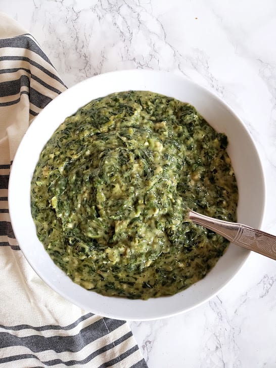 Creamed Spinach Recipe overhead shot showing decadent cremy texture. This steakhouse creamed spinach recipe is plant based vegan and glutenfree yet creamy and decadent.