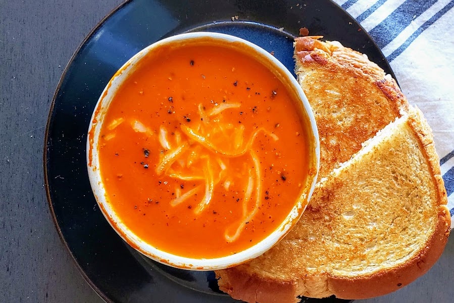 An overhead image of a soup bowl filled with thick and creamy soup.