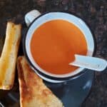 Instant Pot Tomato Soup served with grilled cheese sandwich.