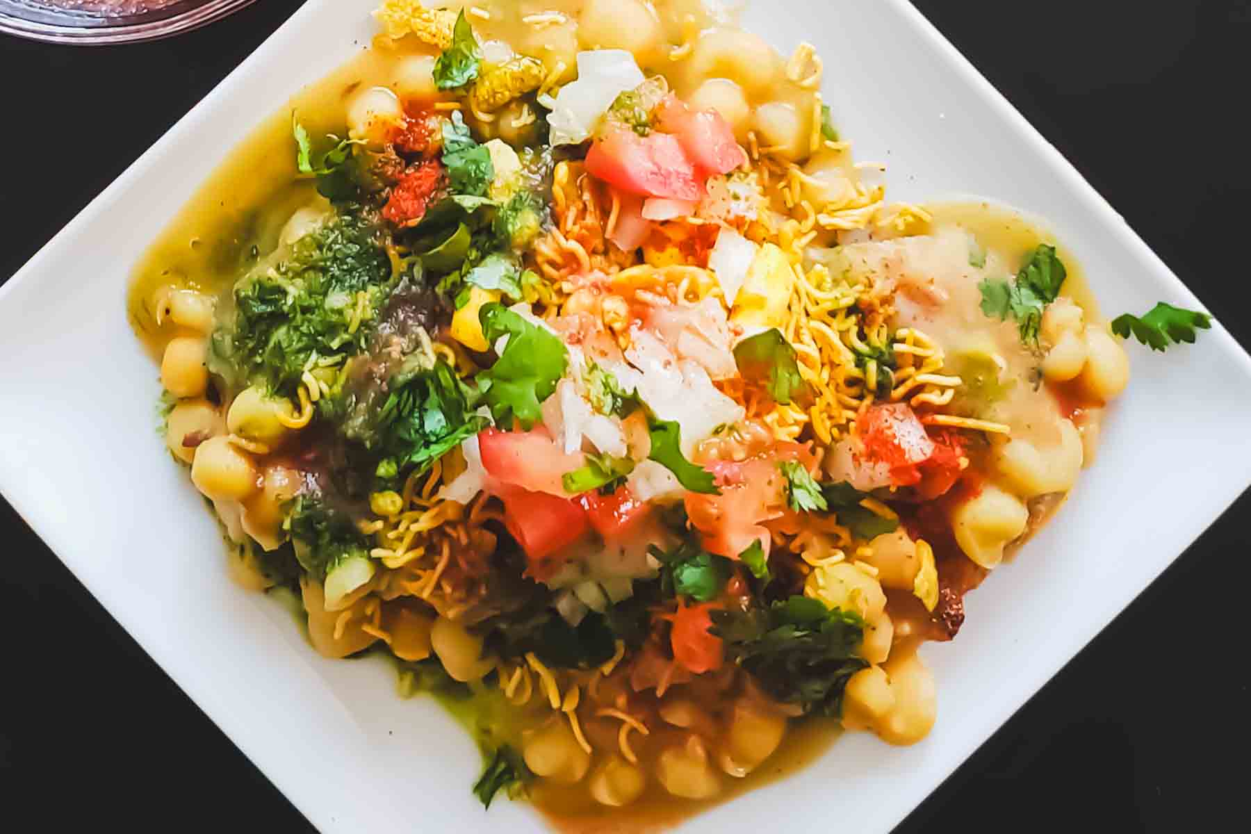 Street-style ragda patties assembled with toppings.