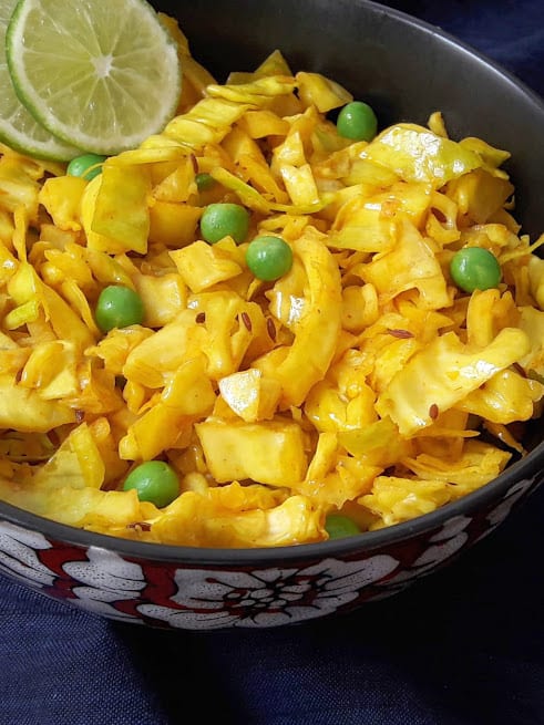 Close up photo of Cabbage peas turmeric stirfry showing beautiful color and crunchy texture. 