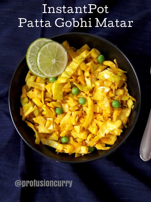 Golden hued turmaric cabbage and peas stirfry served with lime wedges. This profusioncurry recipe is popular Indian vegetarian dinner dish.