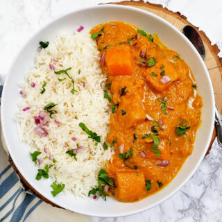 Diced pumpkin cooked in delicious creamy peanut coconut thai red curry. This vegan and gluten free curry recipe is perfect for weeknight dinner and lunch prep.